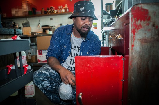 Milan Hawthorne, 35, works part time as a barista at the Chasing Lions Cafe located near City College of San Francisco Ocean Campus on Wednesday, July 22, 2015. (Photo by Ekevara Kitpowsong/Bay News Rising)