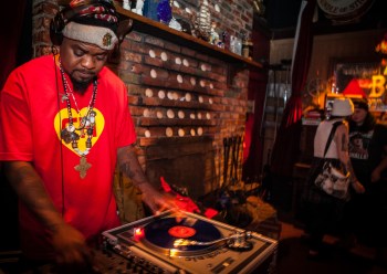 (L-R) D.J. Milan Hawthorne “BeatsMe” spins a mix of music while guests Gabby Petrocelli and Taylor Deluca enjoy the night at The Riptide bar in Sunset District, San Francisco on Thursday, July 23, 2015. (Photo by Ekevara Kitpowsong/Bay News Rising)
