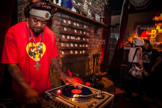 (L-R) D.J. Milan Hawthorne “BeatsMe” spins a mix of music while guests Gabby Petrocelli and Taylor Deluca enjoy the night at The Riptide bar in Sunset District, San Francisco on Thursday, July 23, 2015. (Photo by Ekevara Kitpowsong/Bay News Rising) 