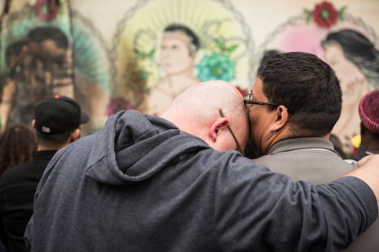 A couple mourns the damage to a vandalize LGBT-themed mural (Photo by Khaled Sayed/Bay News Rising)
