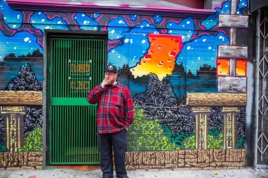 The art gallery curator Kevin Dickson stands in front of 2 Cool 4 School Gallery on Geary Street in San Francisco. (Photo by Emilia Rosales/Bay News Rising)