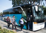 Employees board a shuttle bus headed to Genentech offices. Genentech drivers, along with others from companies like Zynga and Apple, work for Compass Transportation. Drivers are seeking union representation through the Teamsters for contracts with better wages and benefits. (Photo by Erasmo Martinez/Bay News Rising)