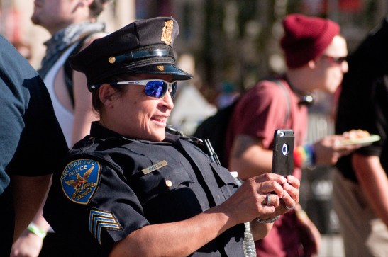 SFPD Officer Chacon taking photos of Pride attendees