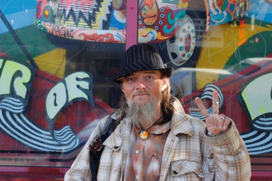 Patrick Bral, a homeless man who frequents the Upper Haight, poses for a photo in front of Amoeba Music on Haight Street on Saturday, June 25, 2016. (Photo by Grady Penna / Bay News Rising) 